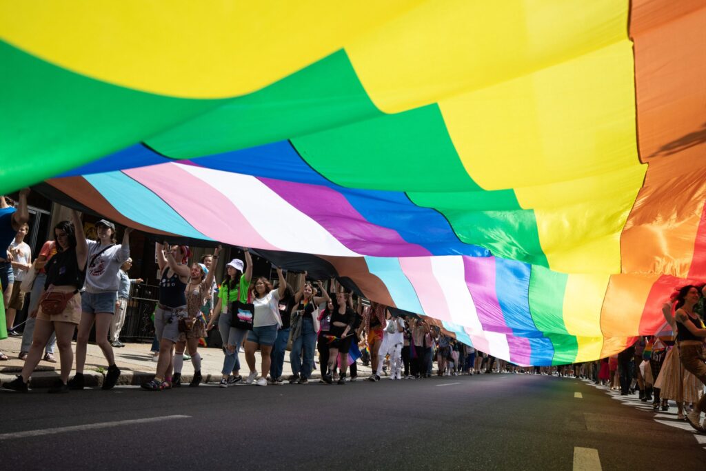 Pride participants wave the largest Pride flag in Pa.