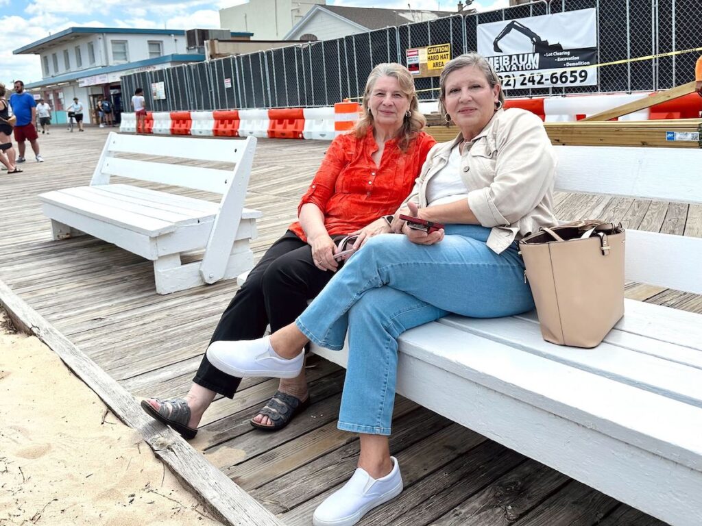 rehoboth-beach-boardwalk-renovation-JPG-052125-04 Long time Rehoboth Beach visitors pose for photo on benches at boardwalk