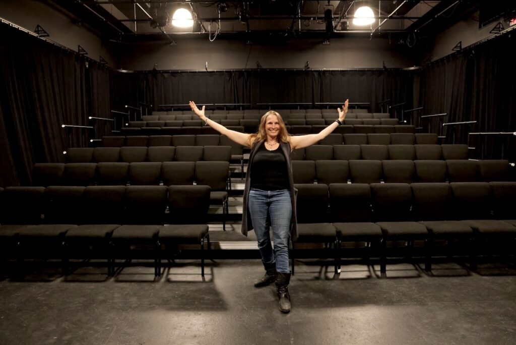 Deborah Block standing in Theatre Exile's performance space