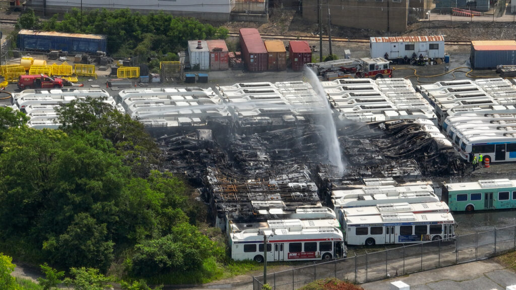 06 05 2025 k paynter SEPTA Midvale Depot fire-2 an aerial view of water being sprayed over the burned SEPTA buses