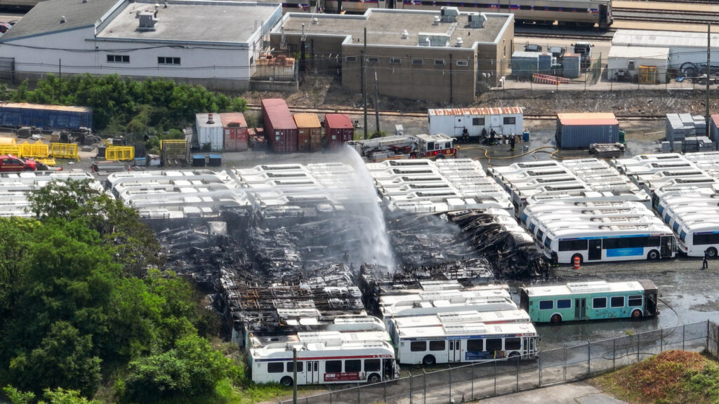06 05 2025 k paynter SEPTA Midvale Depot fire-4 an aerial view of water being sprayed over the burned SEPTA buses