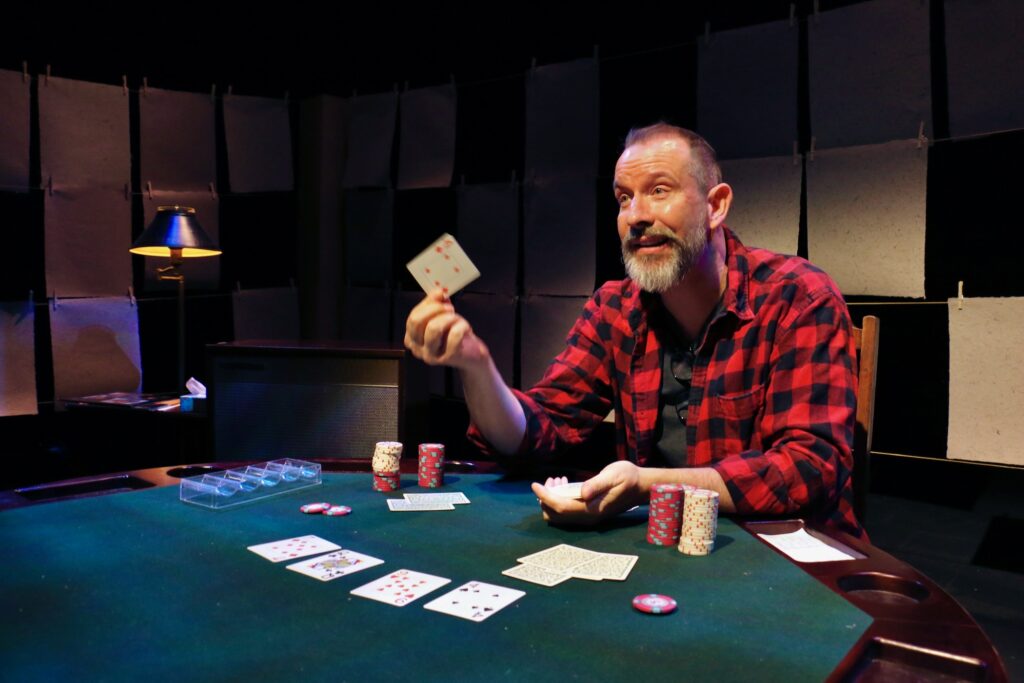 2023 01 11-e lee-charlie delmarcelle-philadelphia louis bluver theatre at the drake-shadow that broke the light poker An actor on stage during a performance