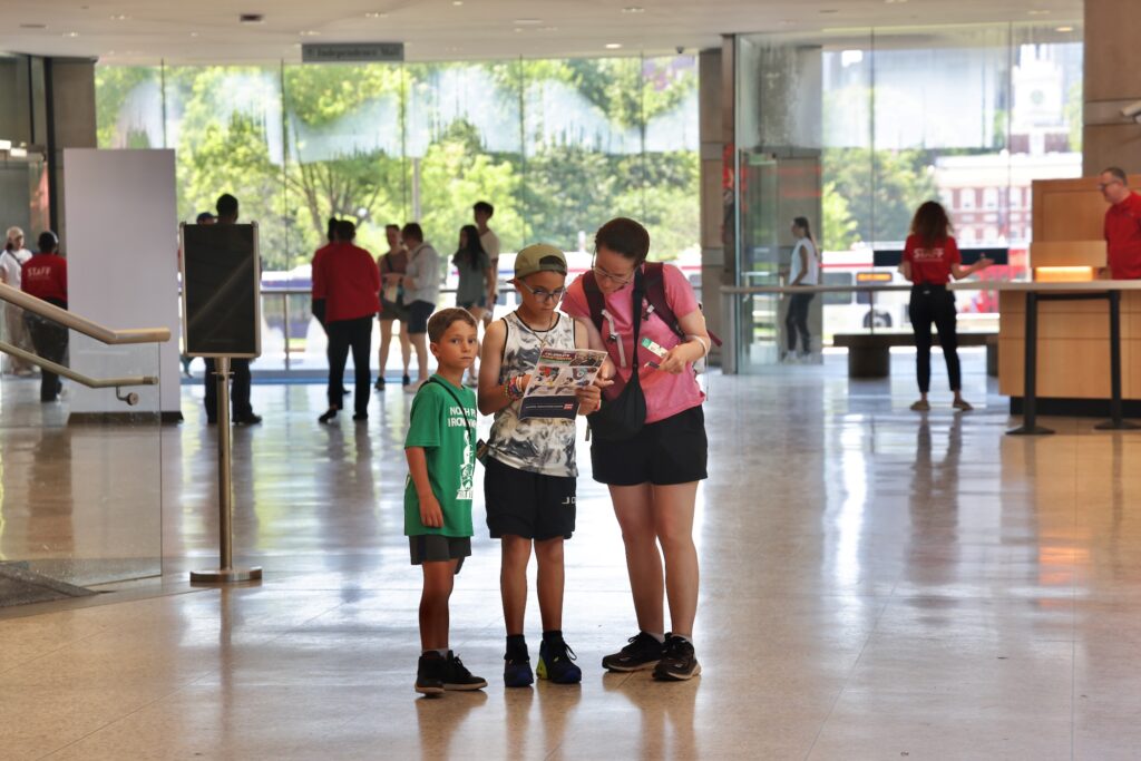 A parent with two children visiting the center