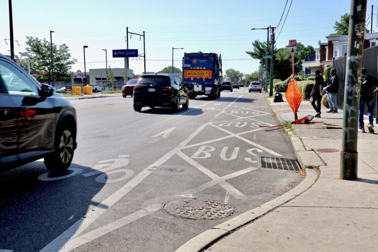 A car encroaches on the bike lane at the intersection of Baltimore Avenue, Cobbs Creek Parkway and 58th Street