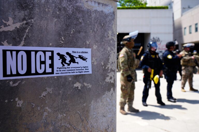 DHS police and National Guard protect the outside the Metropolitan Detention Center in Los Angeles