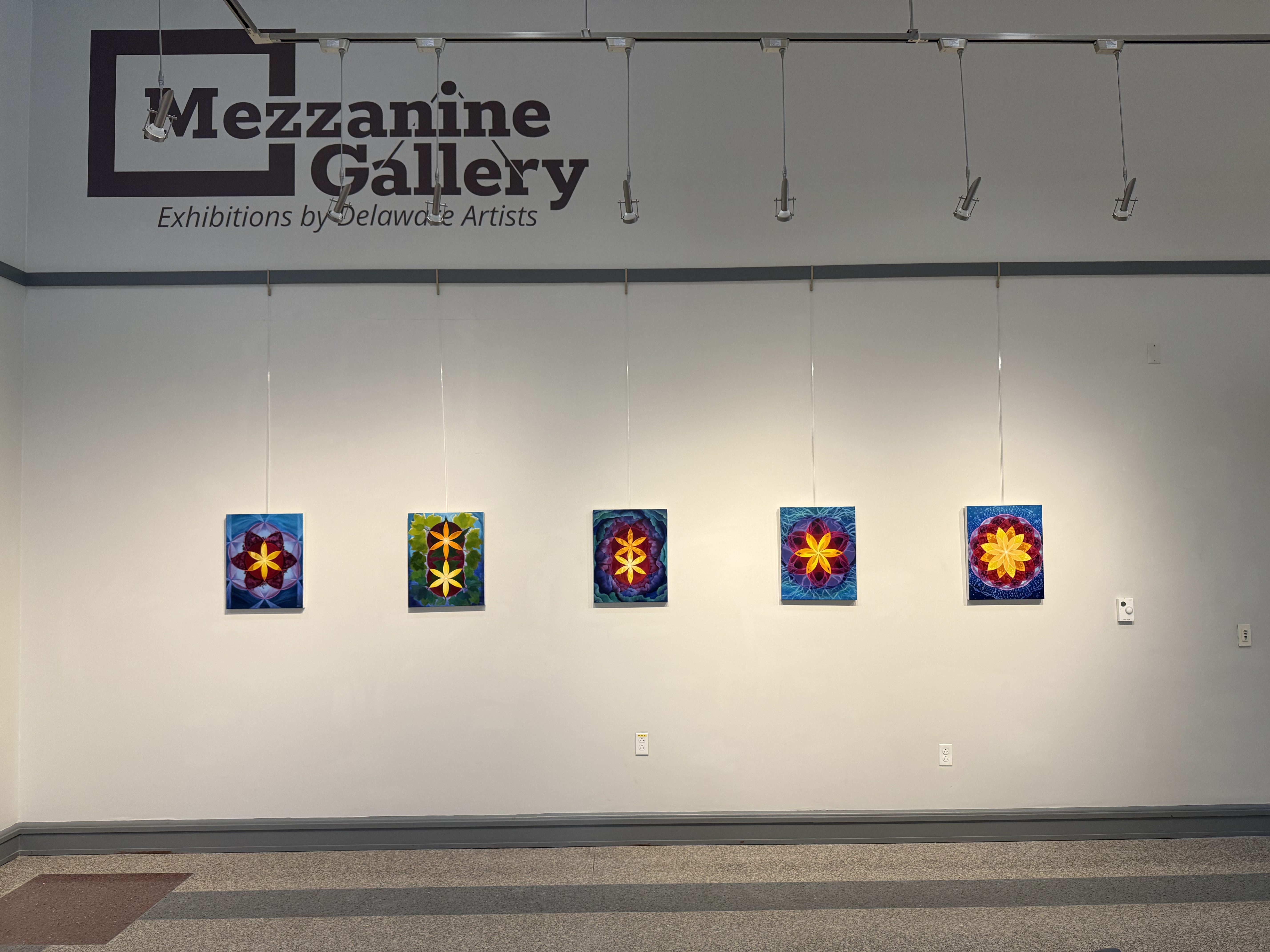 Jen Hintz Eggers paintings on a wall at the Mezzanine Gallery
