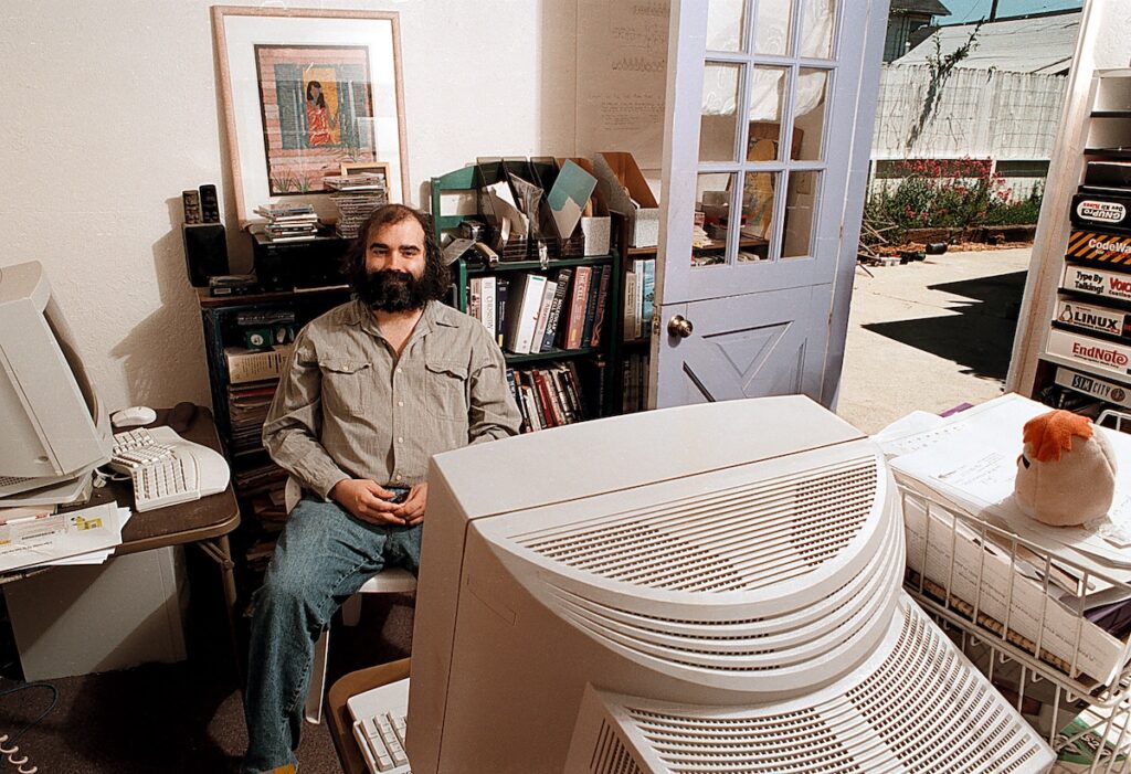 Jim Kent in his office and garage. (Don Harris, UCSC Photo Services)