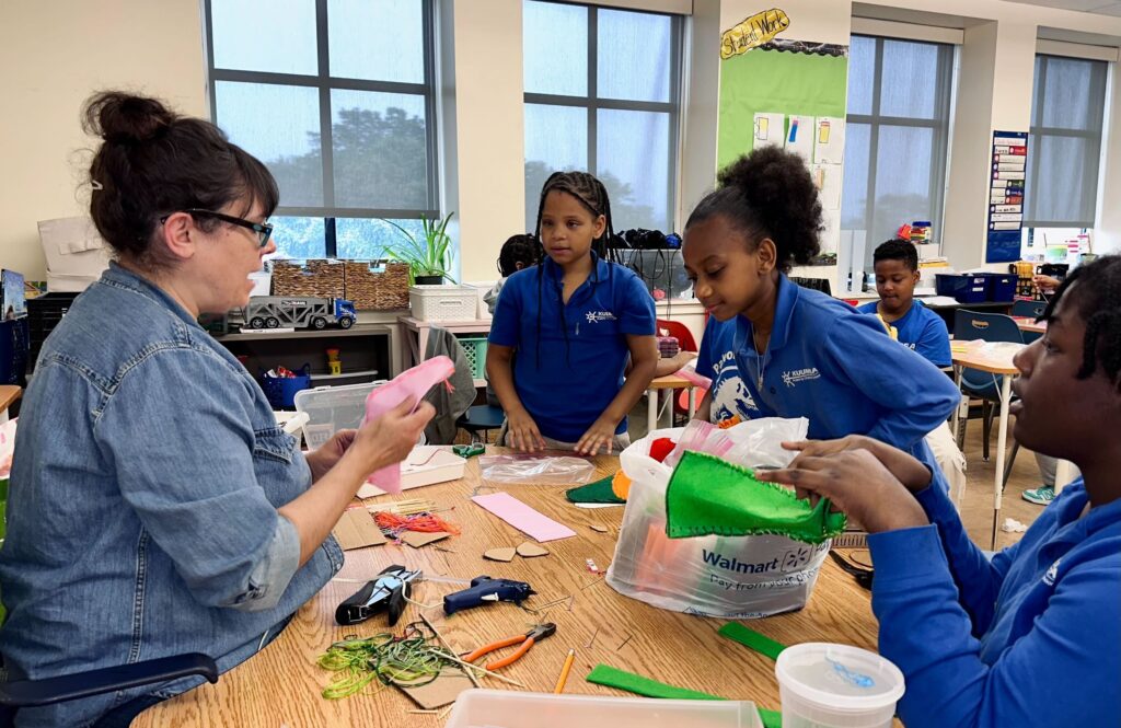 Kuumba-Academy-Delaware-arts-puppets-2025-3-newest Kate Testa helps four students with puppets