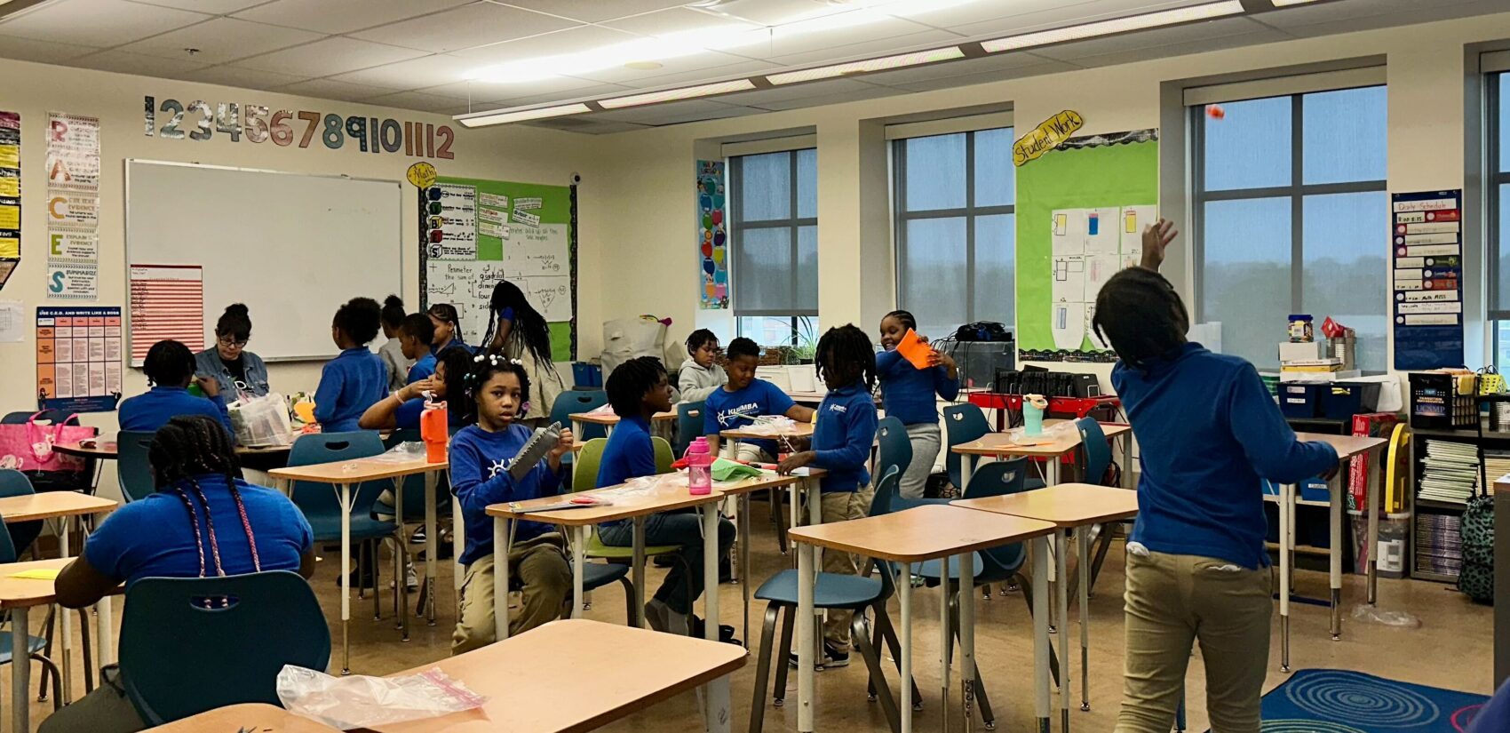 a third-grade classroom filled with students at Kuumba Academy