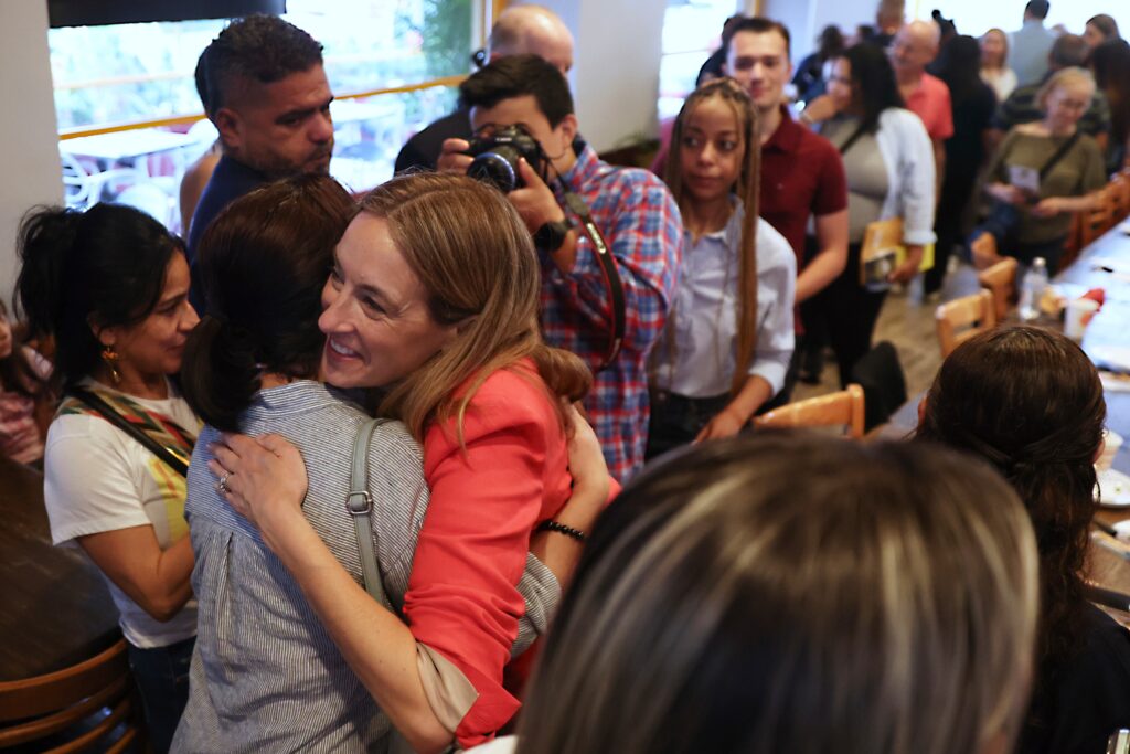 Mikie Sherrill hugs a voter