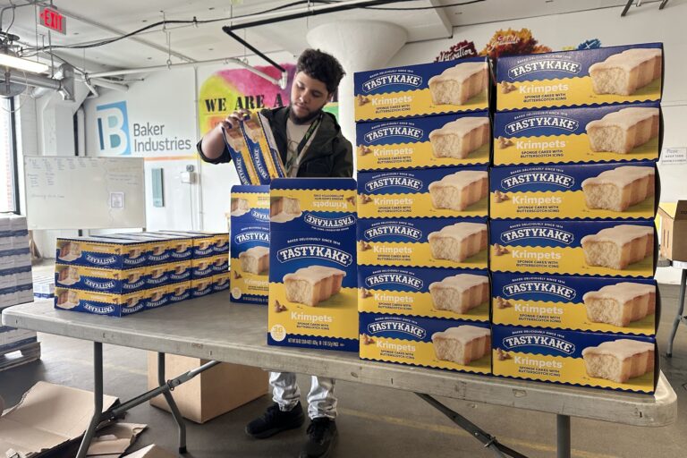 Boxes of Tastykakes stacked on a table
