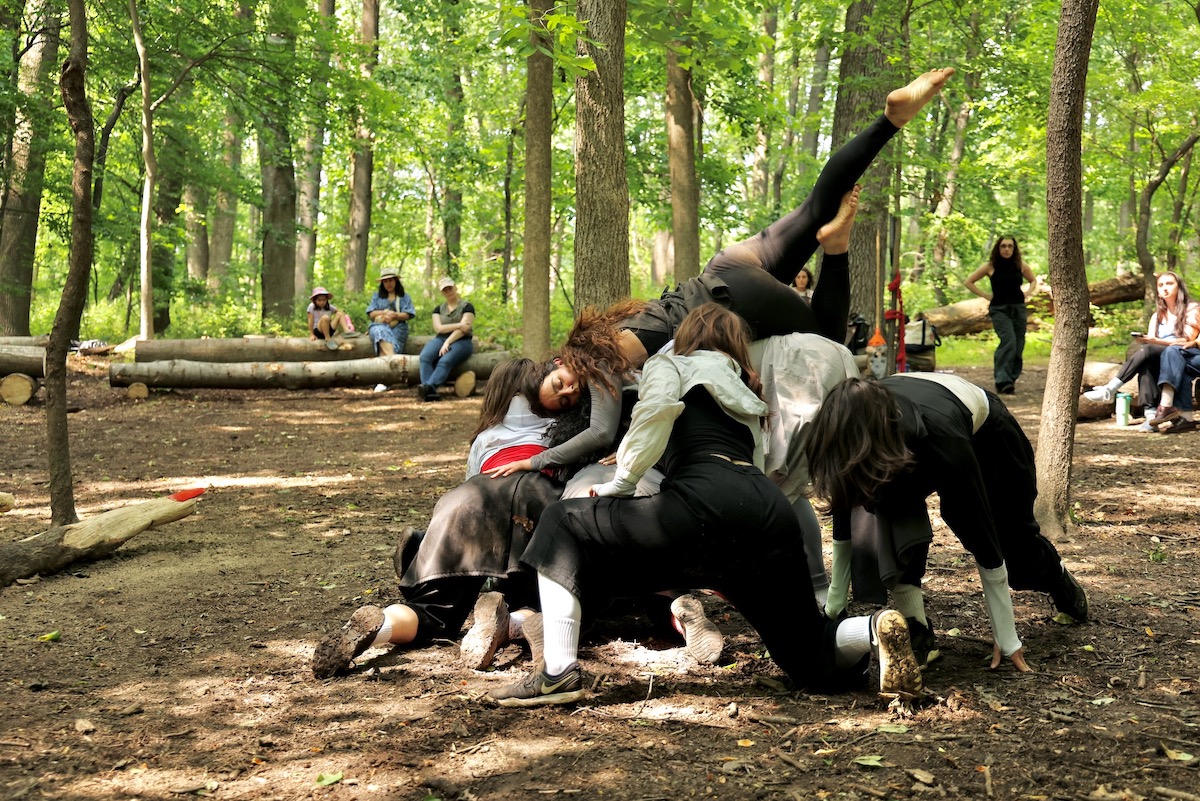 Dancers perform in the woods of the Schuylkill Center