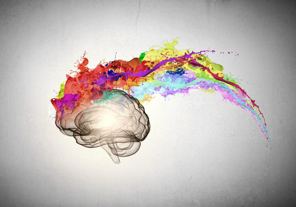 Conceptual image of human brain in colorful splashes Conceptual image of human brain in colorful splashes