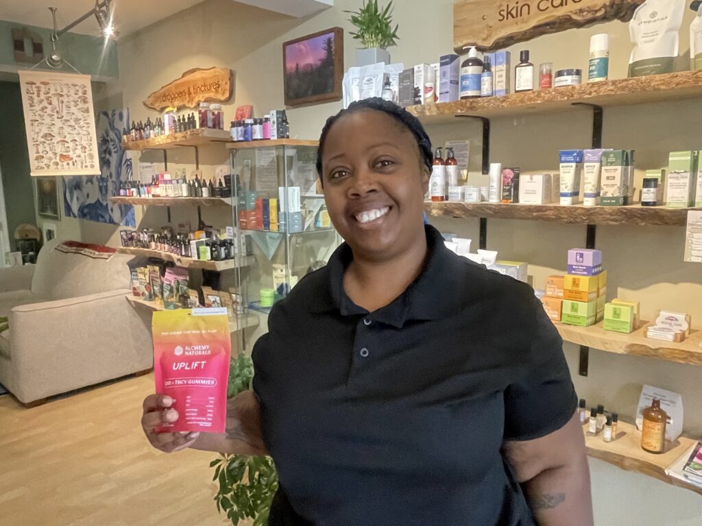 Gretchen Cirwithian posing for a photo inside the store