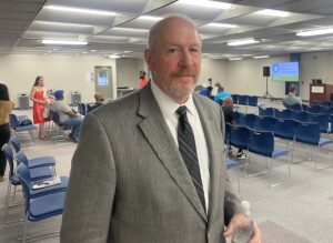 Paul Hyland in a conference room