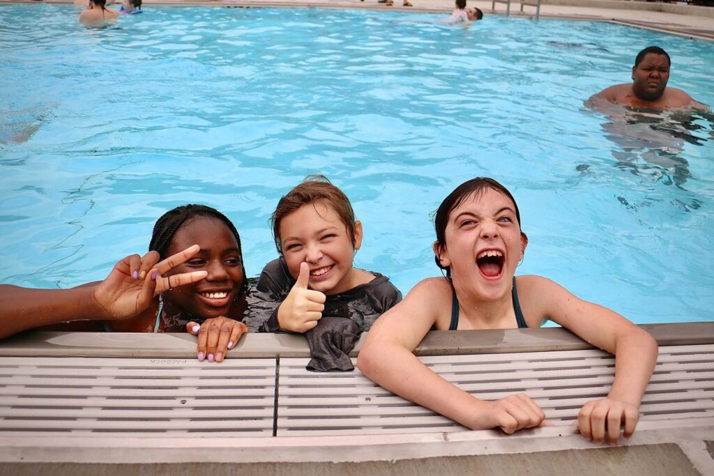 fishtown-pool-e-lee-2022-06-21-3-file three children playing in a pool