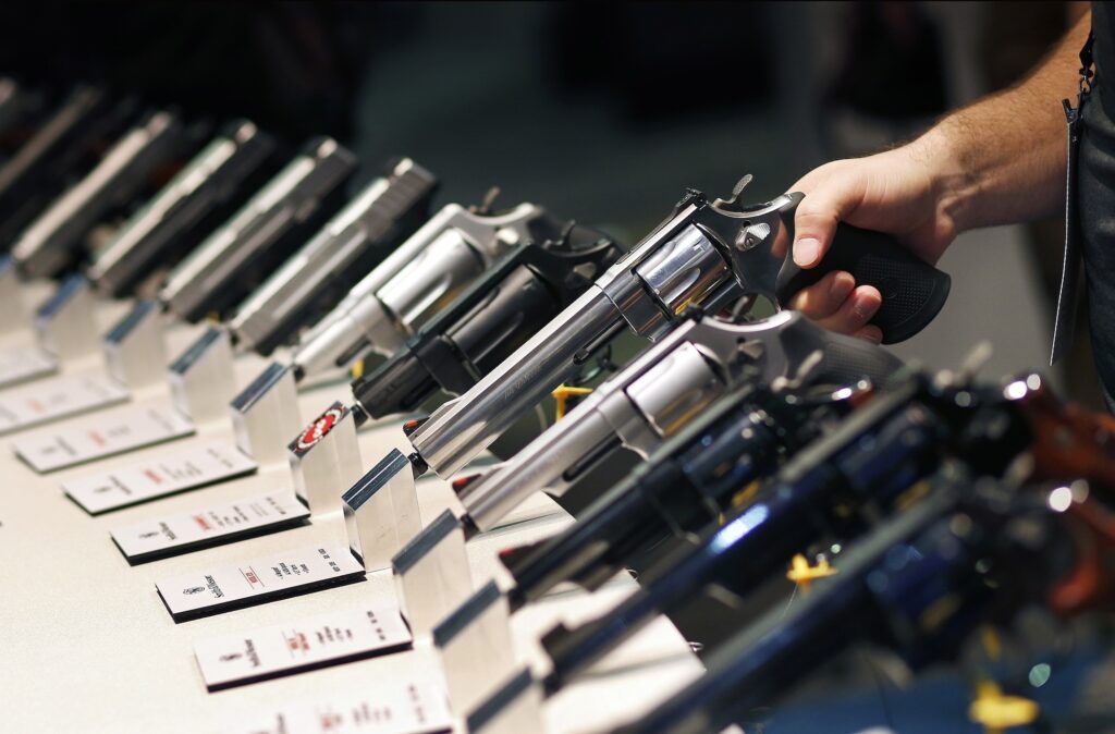 handguns on display at a gun show