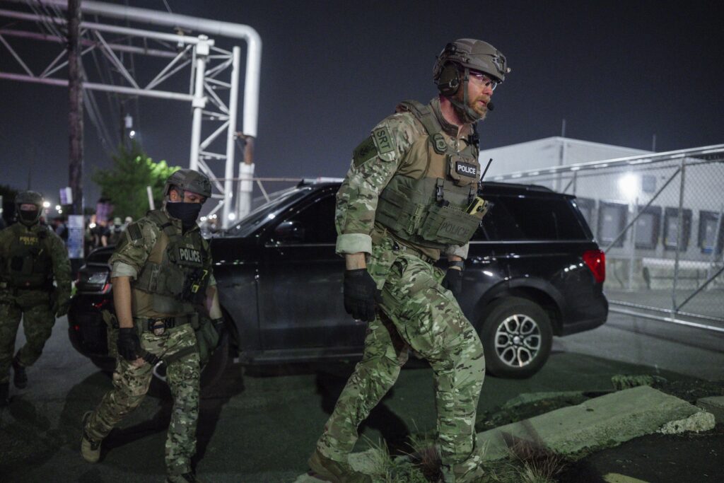 Immigration Protests New Jersey Police officers dressed in combat fatigues