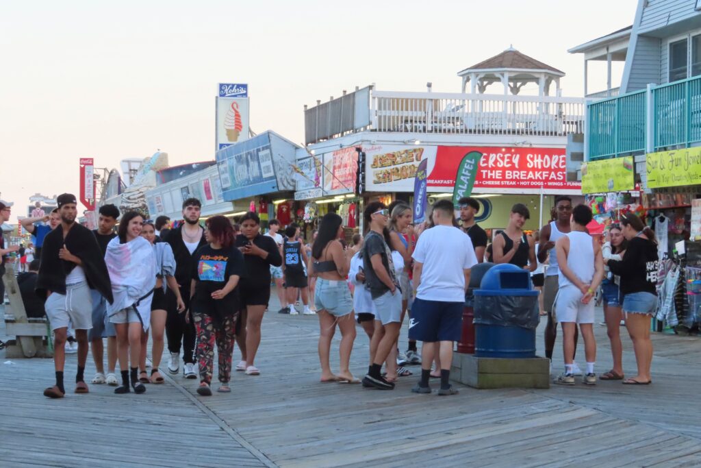 Crowds of people gather on the Seaside Heights New Jersey boardwalk