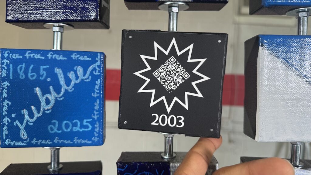 Interactive QR code on art display