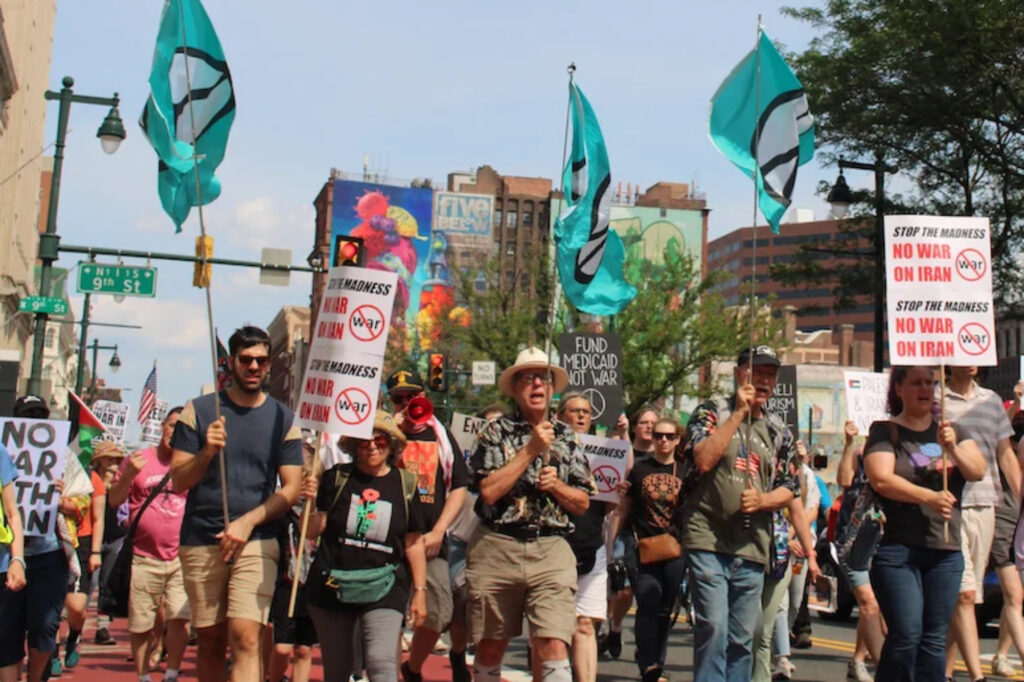 no-war-on-iran-3-philly-protest People march in Philadelphia, calling for the U.S. to not become involved in the Israel-Iran war