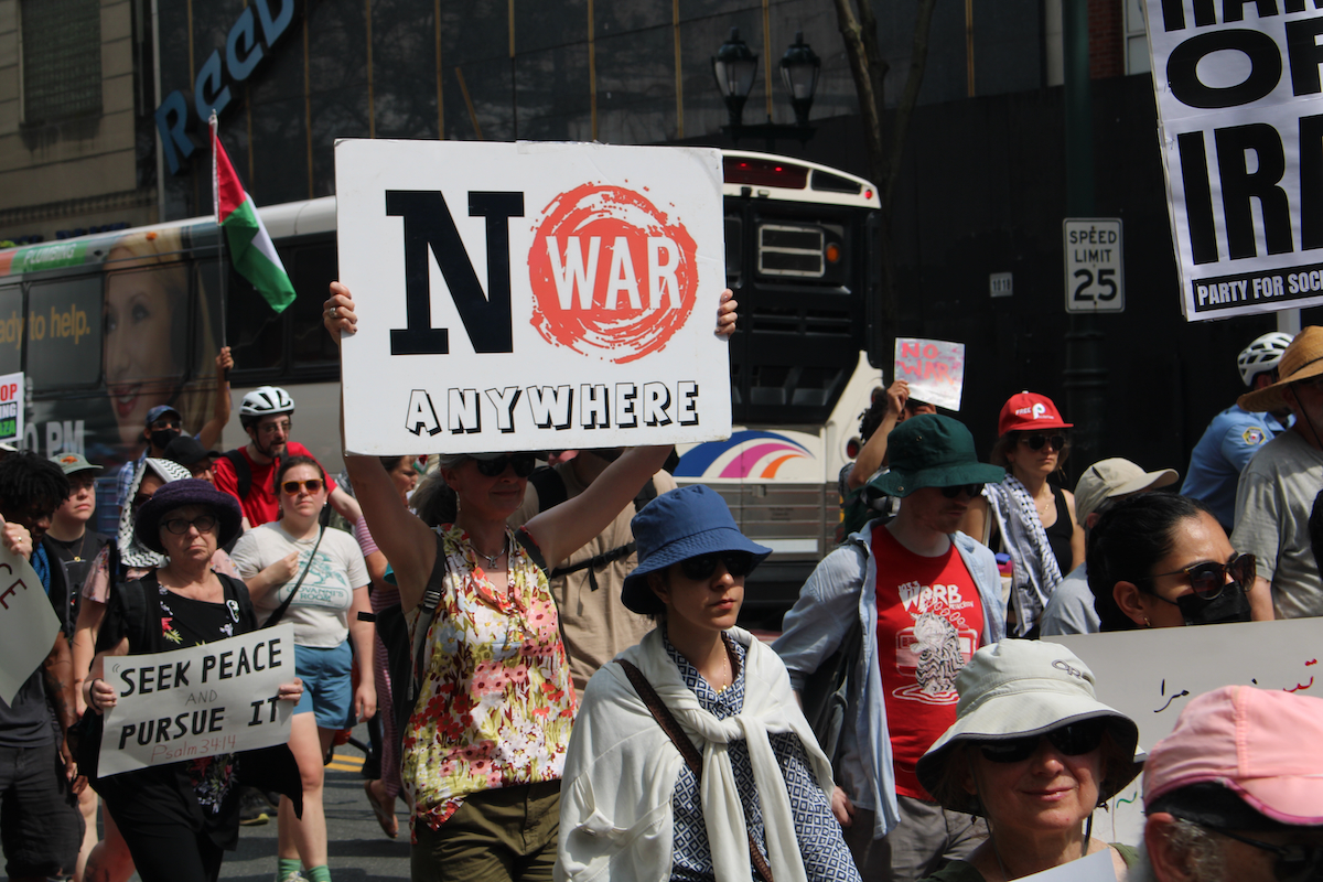 A person holds a sign during a march in Philadelphia that reads 