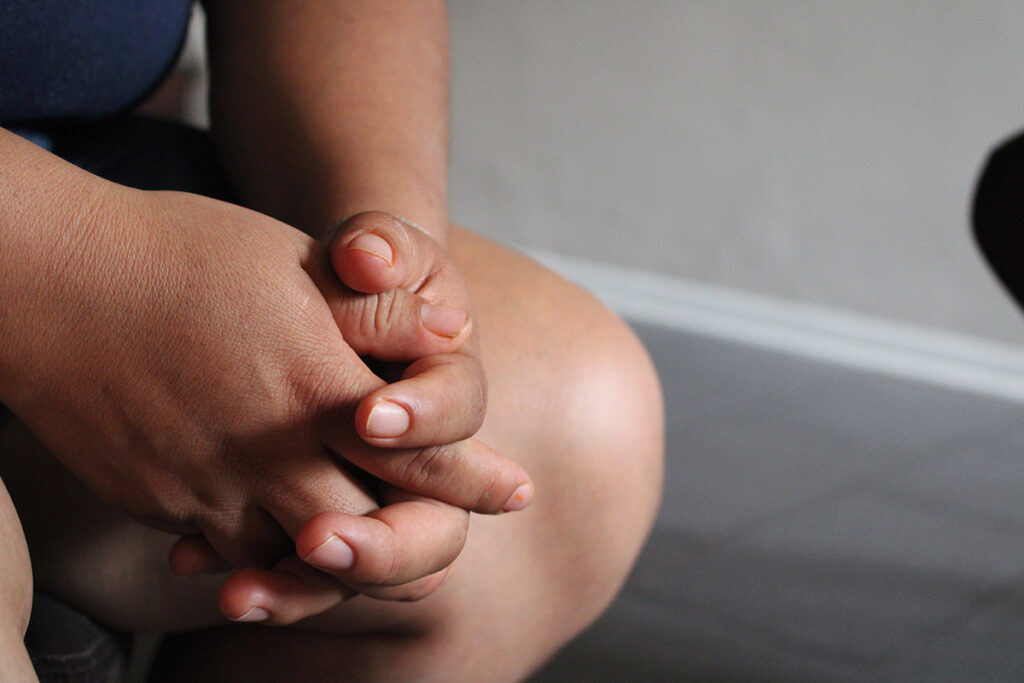 An image of a person's hands folded
