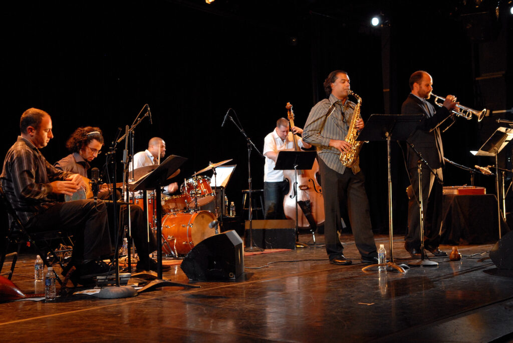 Musicians play instruments on stage
