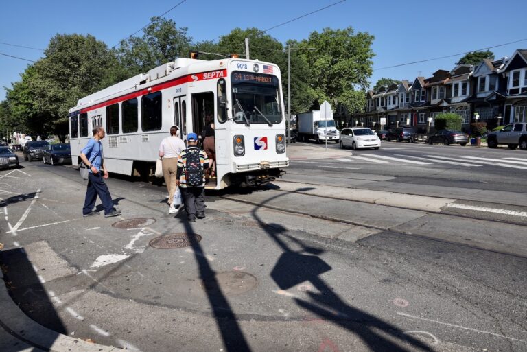 People boarding trolley at 58th Street and Cobbs Creek Parkway