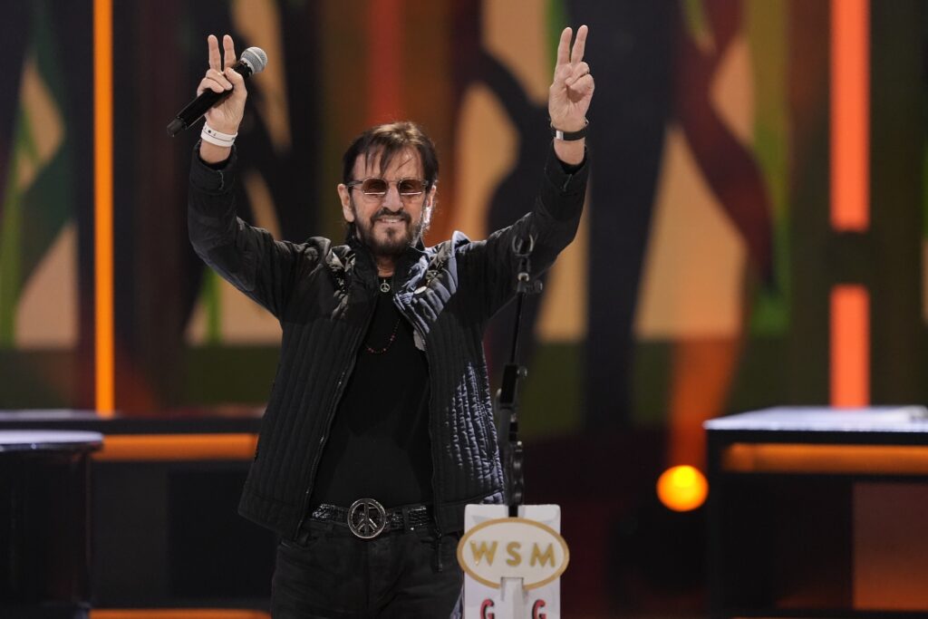 Ringo Starr Grand Ole Opry Ringo Starr holds up the peace sign