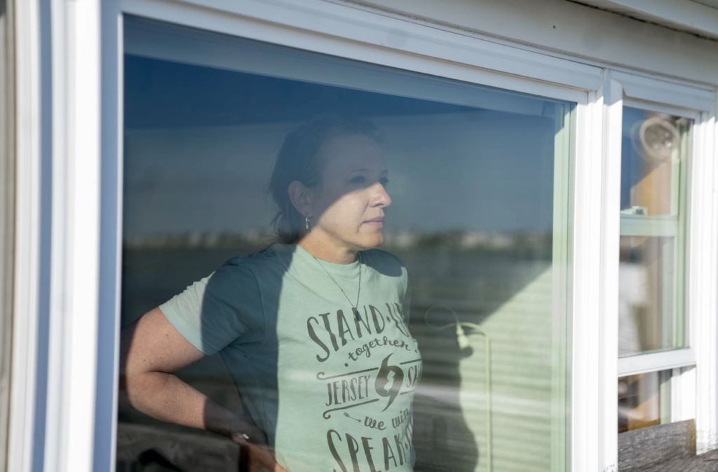 Devecka-Rinear looking out of a window