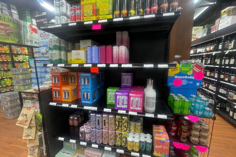 shelves stocked with beverages in a store
