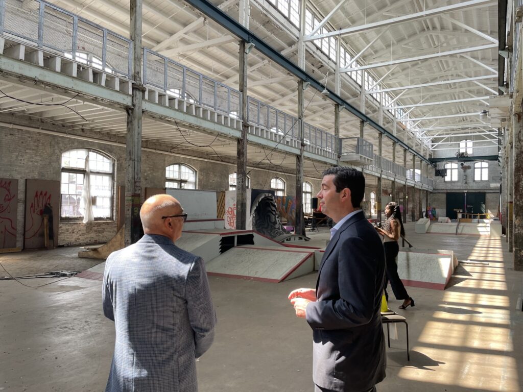 Trenton Mayor Reed Gusciora speaks with New Jersey Economic Development Authority CEO Tim Sullivan inside the Roebling Wire Works building