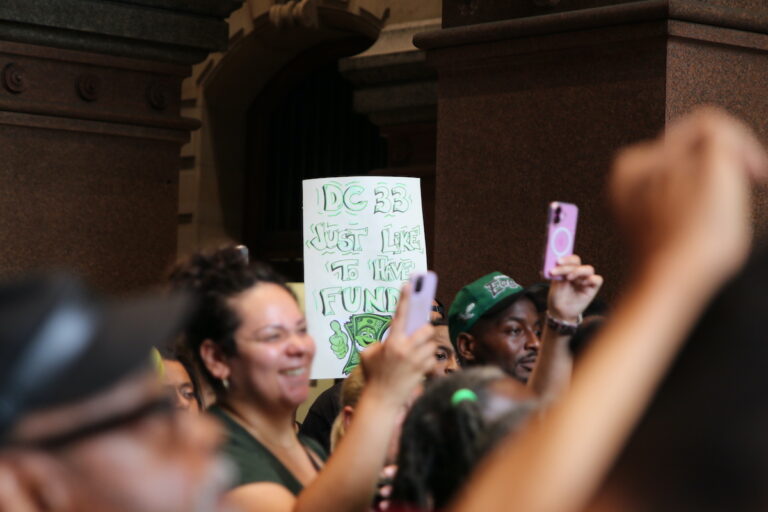 Union members and supporters marched around City Hall