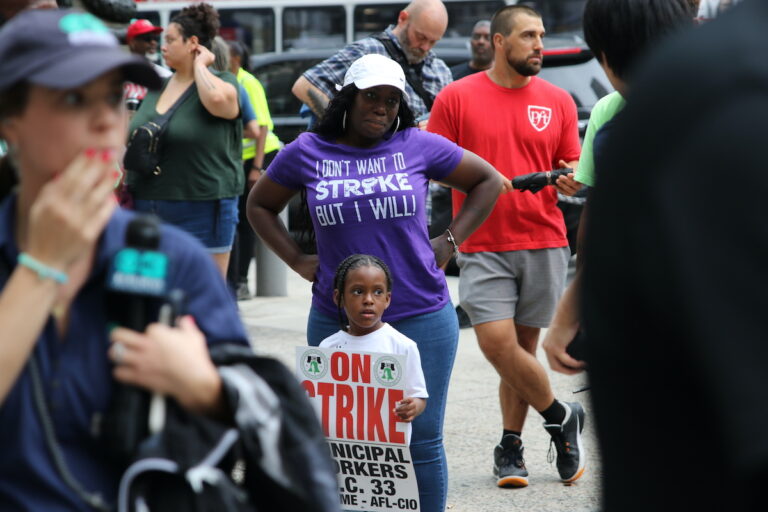 Union members and supporters marched around City Hall