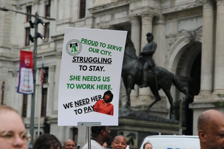 Union members and supporters marched around City Hall