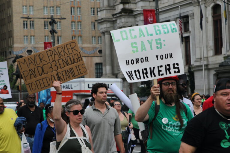 Union members and supporters marched around City Hall