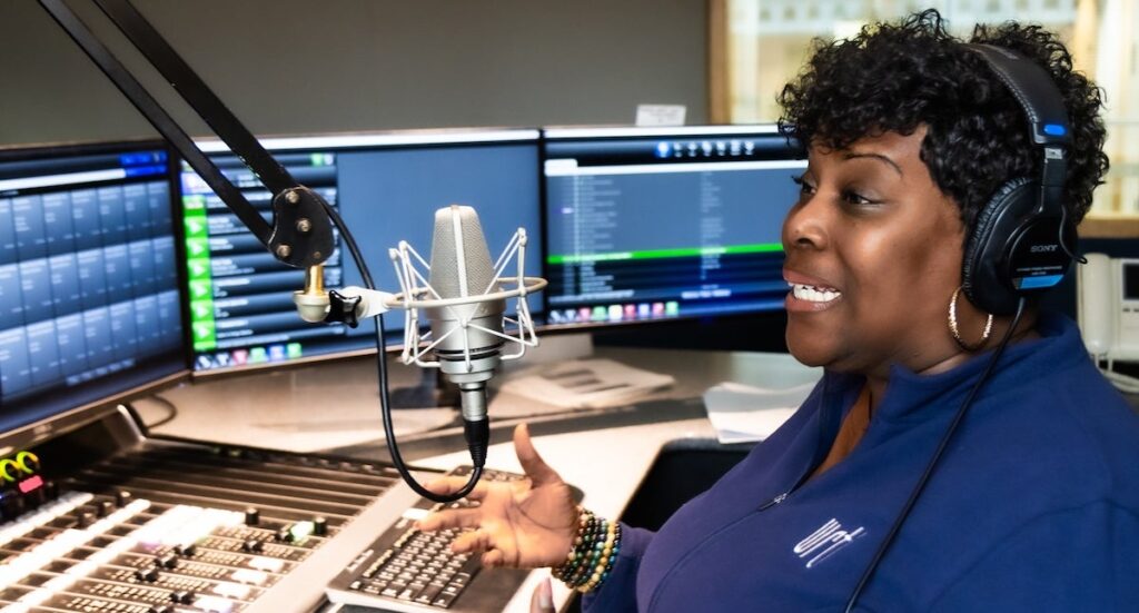 Nicole Sweeney on the mic at the station’s studio