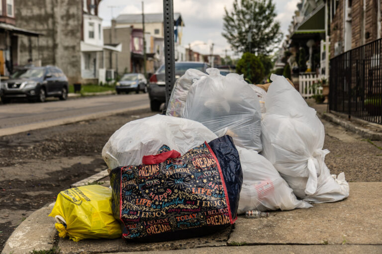 Trash left on the curb in North Philadelphia the first day of the city municipal workers strike July 1, 2025.