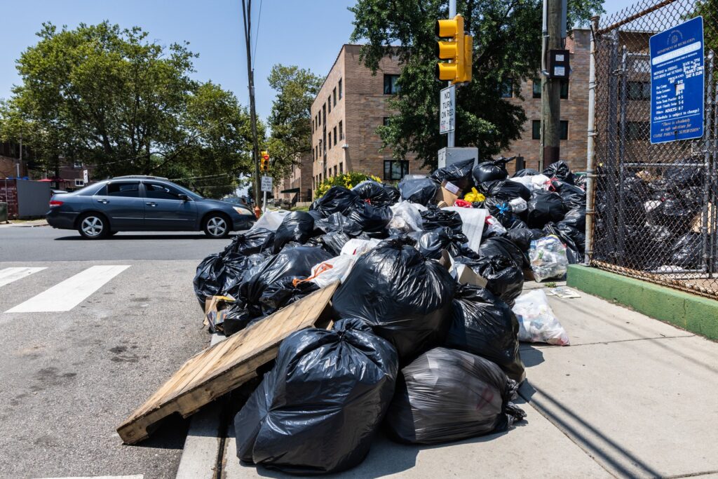 A pile of trash bags at Piccoli Playground