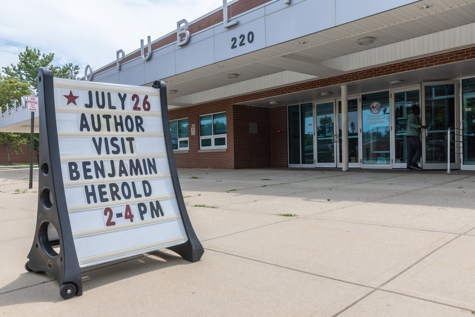 a sign outside Willingboro Public Library reads JULY 26 AUTHOR VISIT BENJAMIN HEROLD 2-4 PM