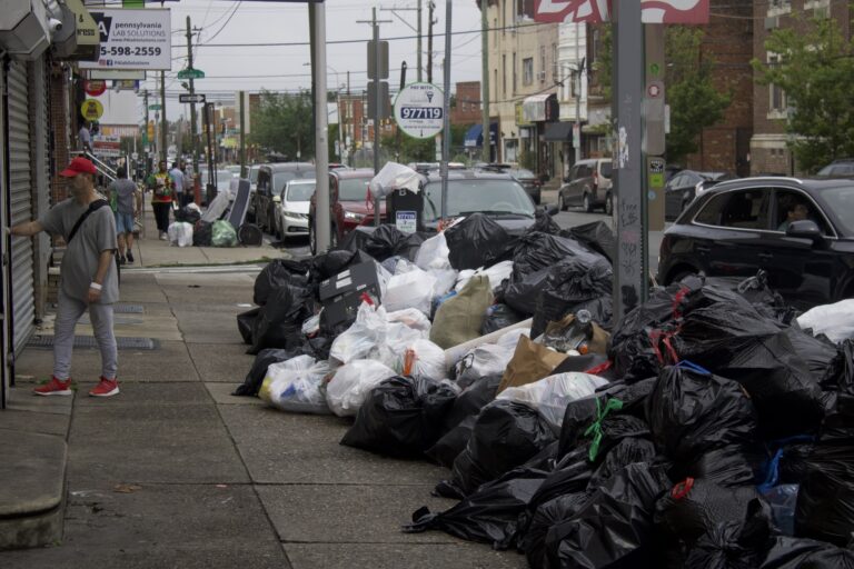 trash piled up on the street at Broad Street and Snyder Avenue in Philadelphia