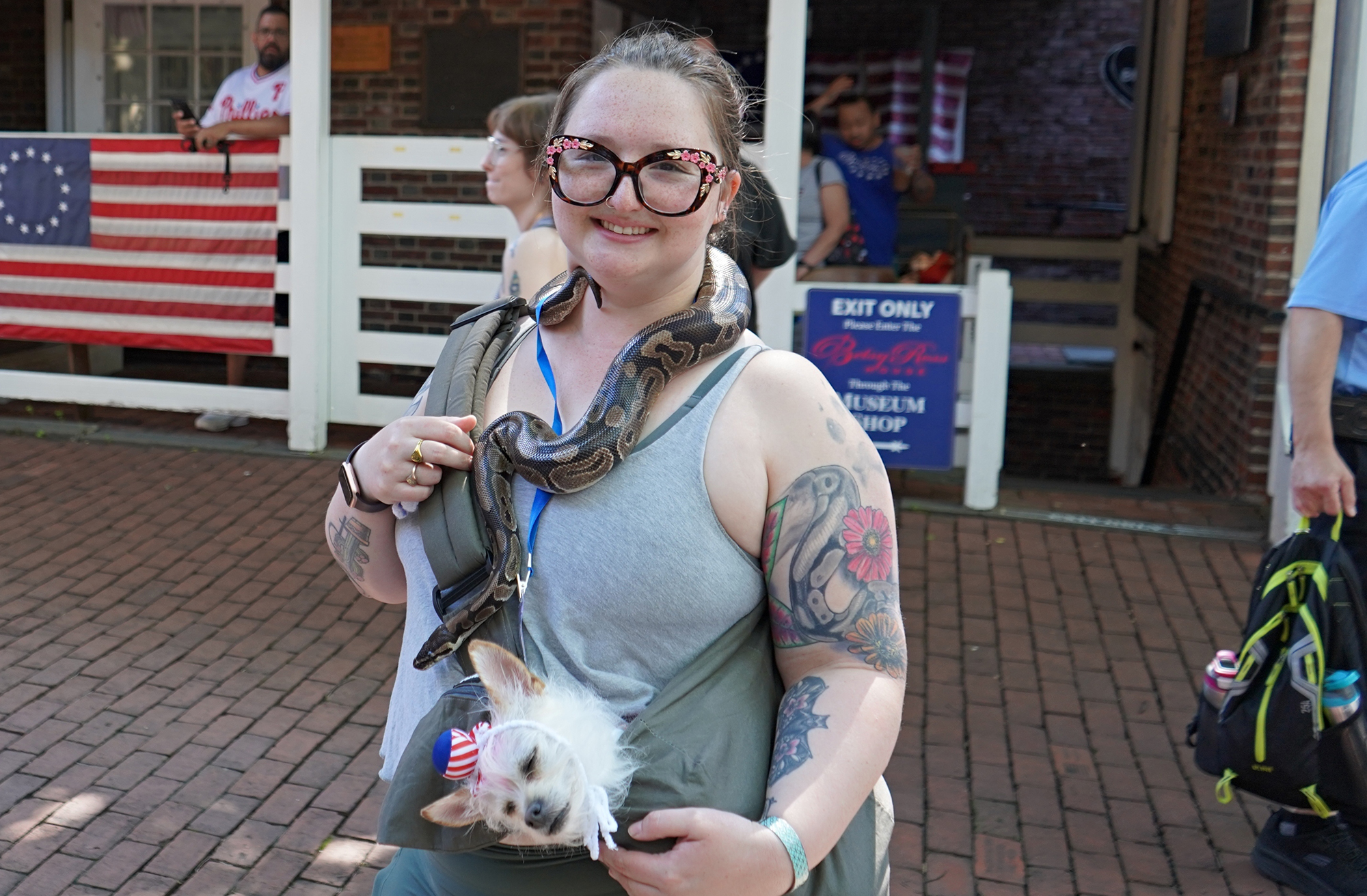 A woman poses with her ball python