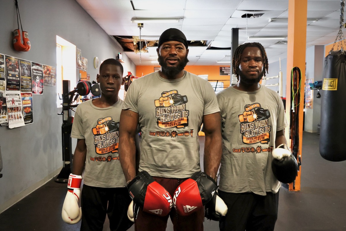 Michael Hilton (center) with participants Aaron Geddes, 11 (left), and D'Andre Marks (right)