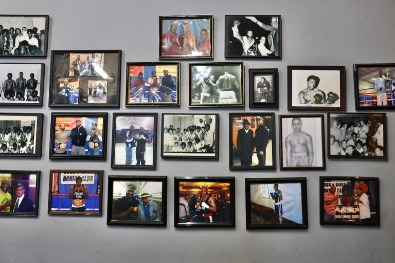 Photographs of boxing triumphs line the walls at Ike Williams Boxing Academy