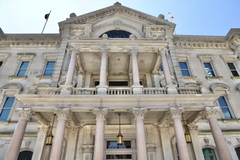 Looking up at the impressive building at the entrance of the State House