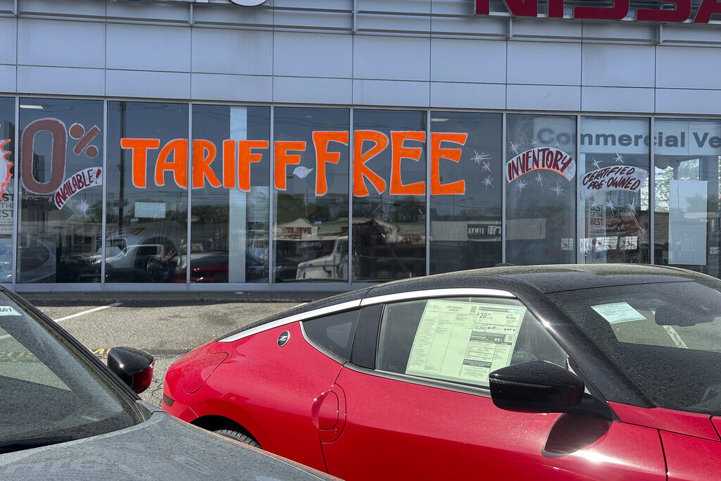 Trump Tariffs-Business Response A Tariff Free sign to attract vehicle shoppers is at an automobile dealership in Totowa, N.J., on April 30, 2025. (AP Photo/Ted Shaffrey)