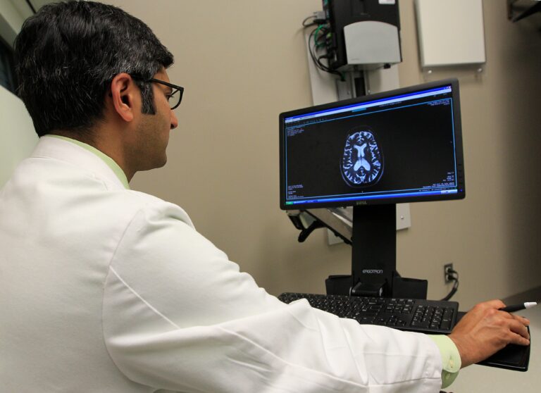 A doctor reviews an MRI