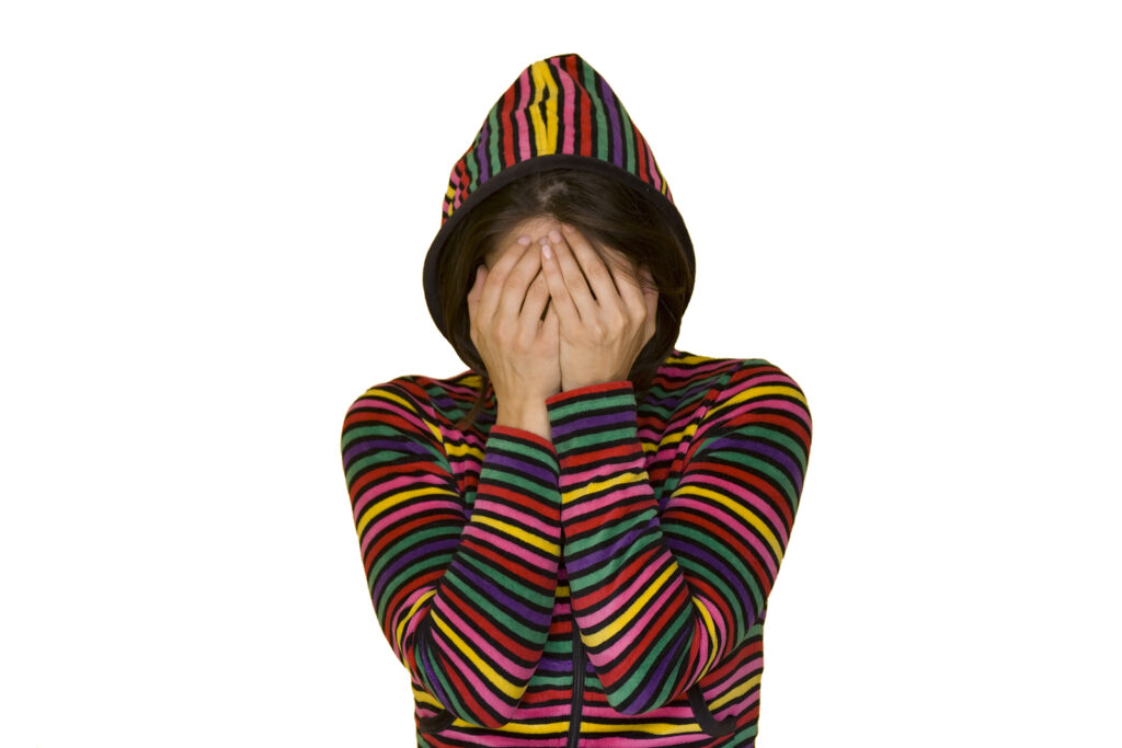 a teenage girl with shame isolated on white