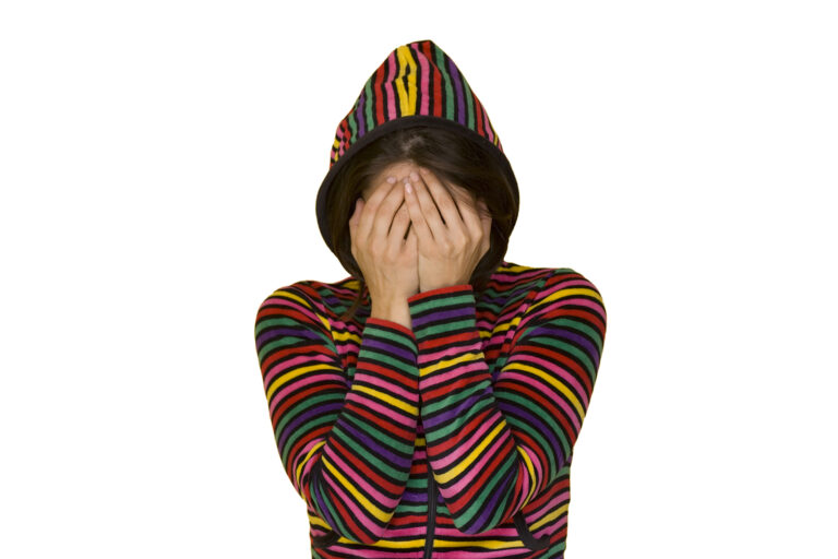 a teenage girl with shame isolated on white